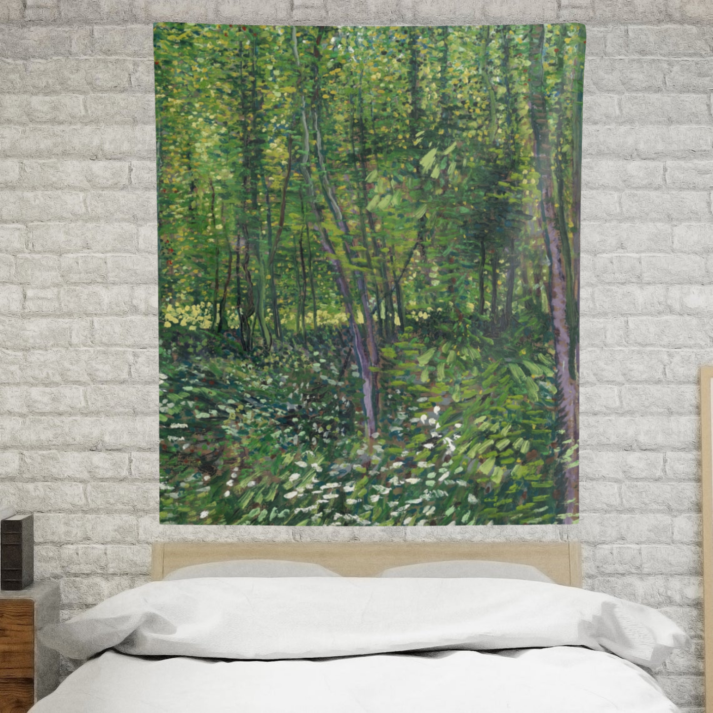 a bedroom with a brick wall and a painting on the wall