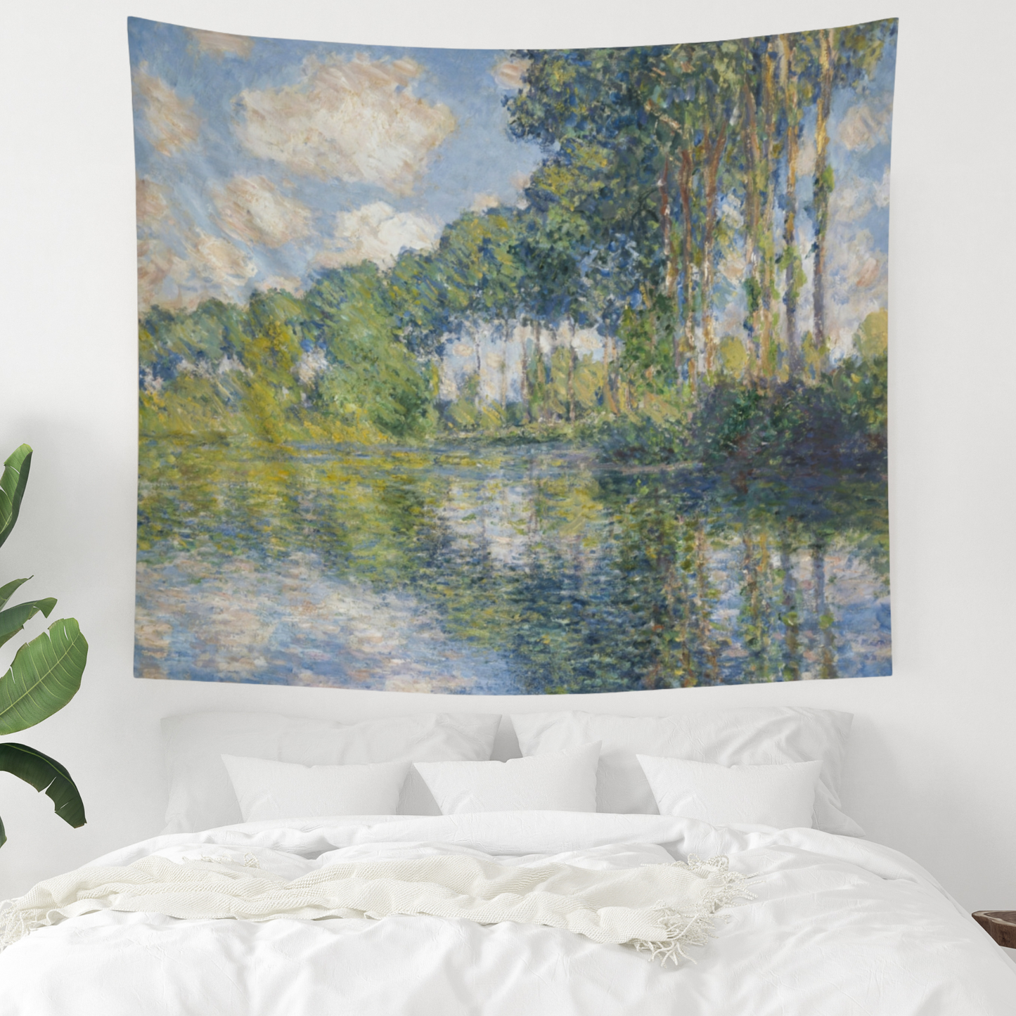 a bedroom with a large painting on the wall