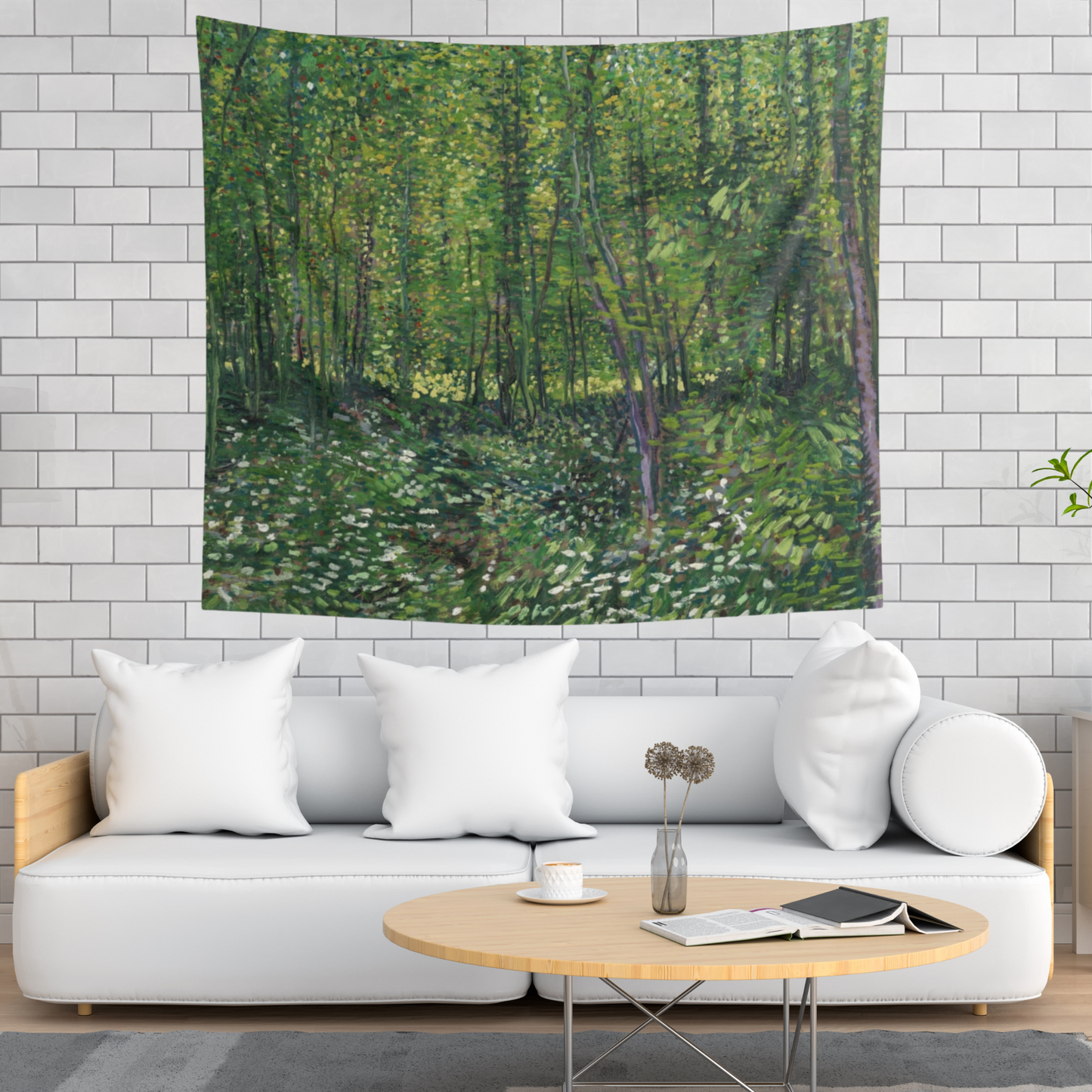 a living room with a white couch and a painting on the wall