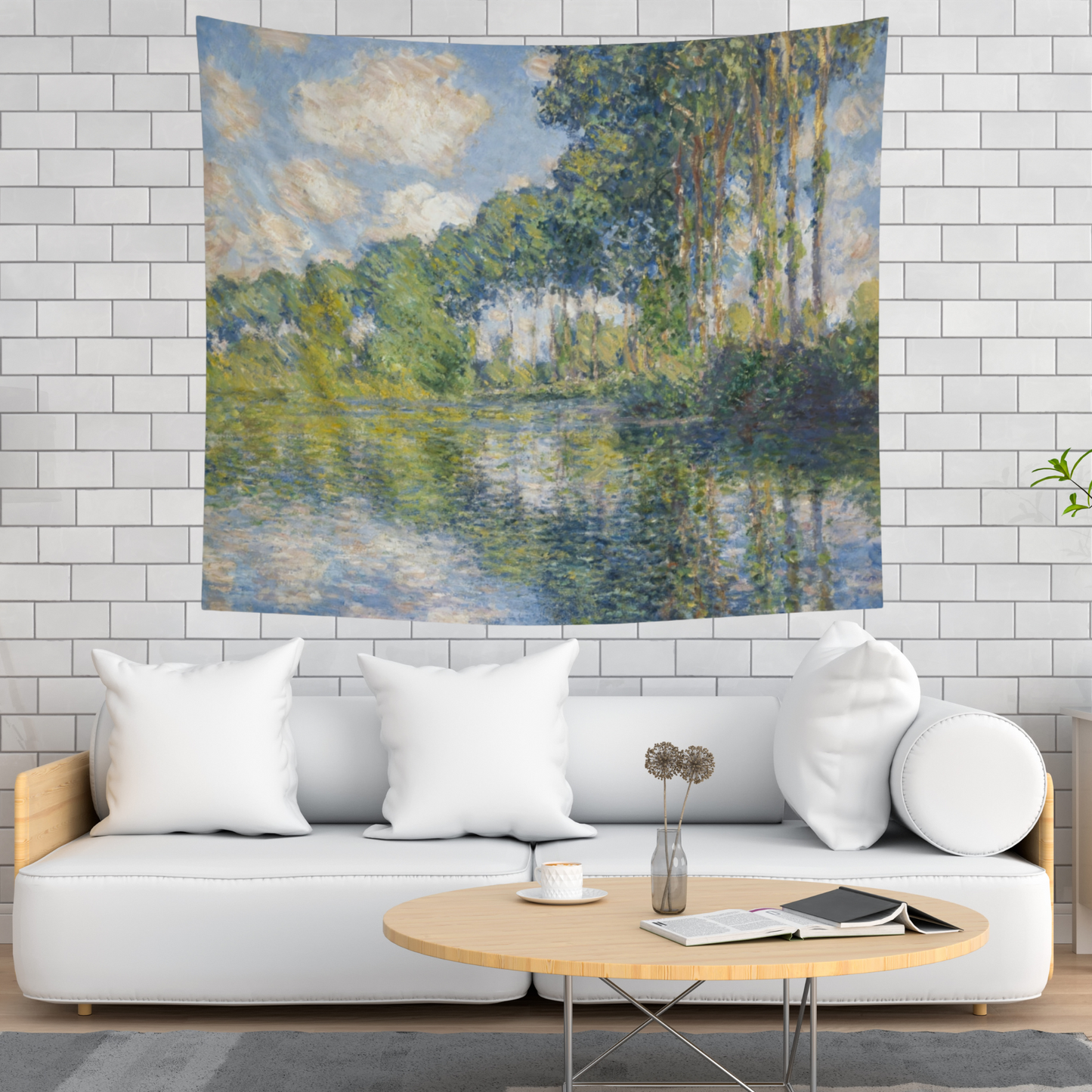 a living room with a white couch and a painting on the wall