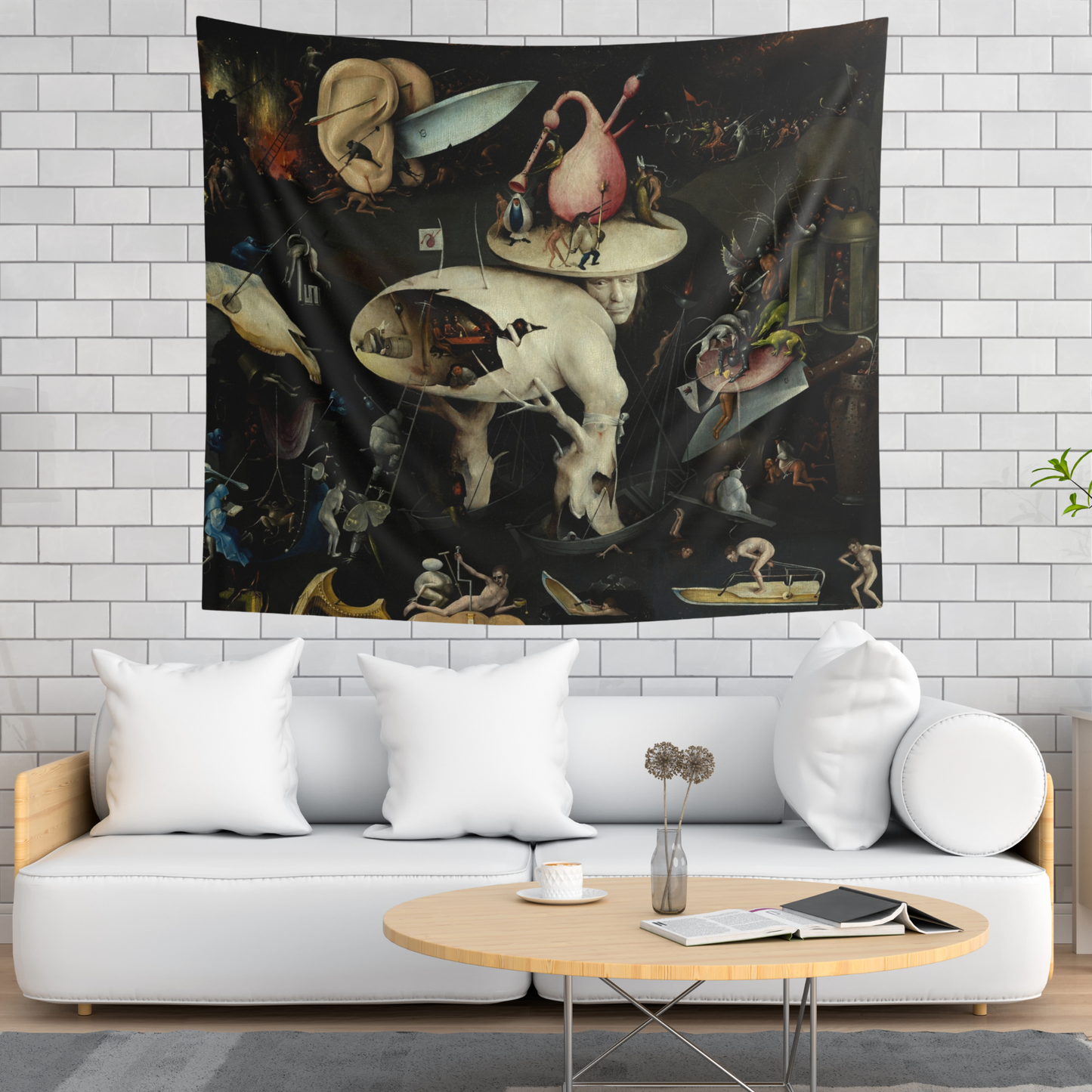 a living room with a white couch and a painting on the wall
