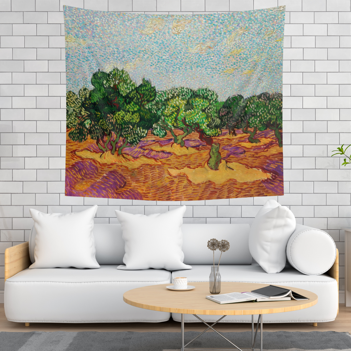 a living room with a white couch and a painting on the wall