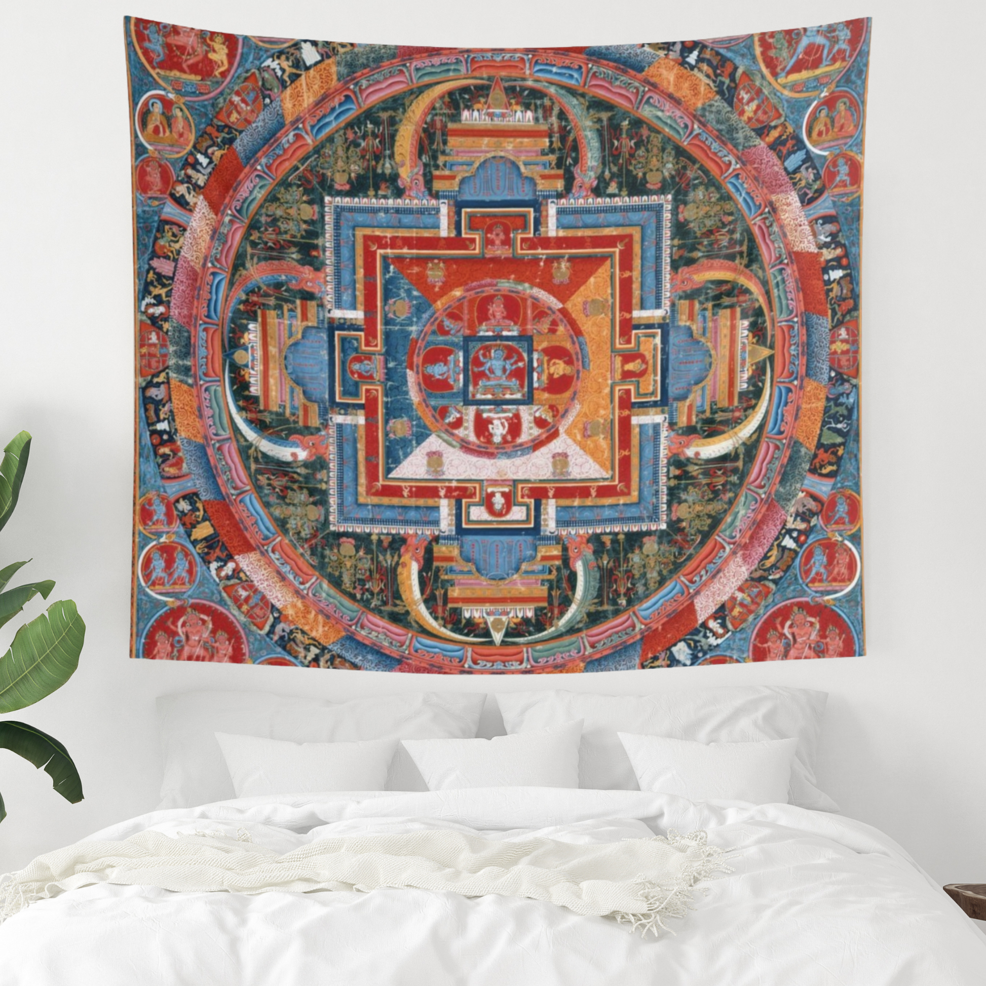 a tapestry hanging on a wall above a bed