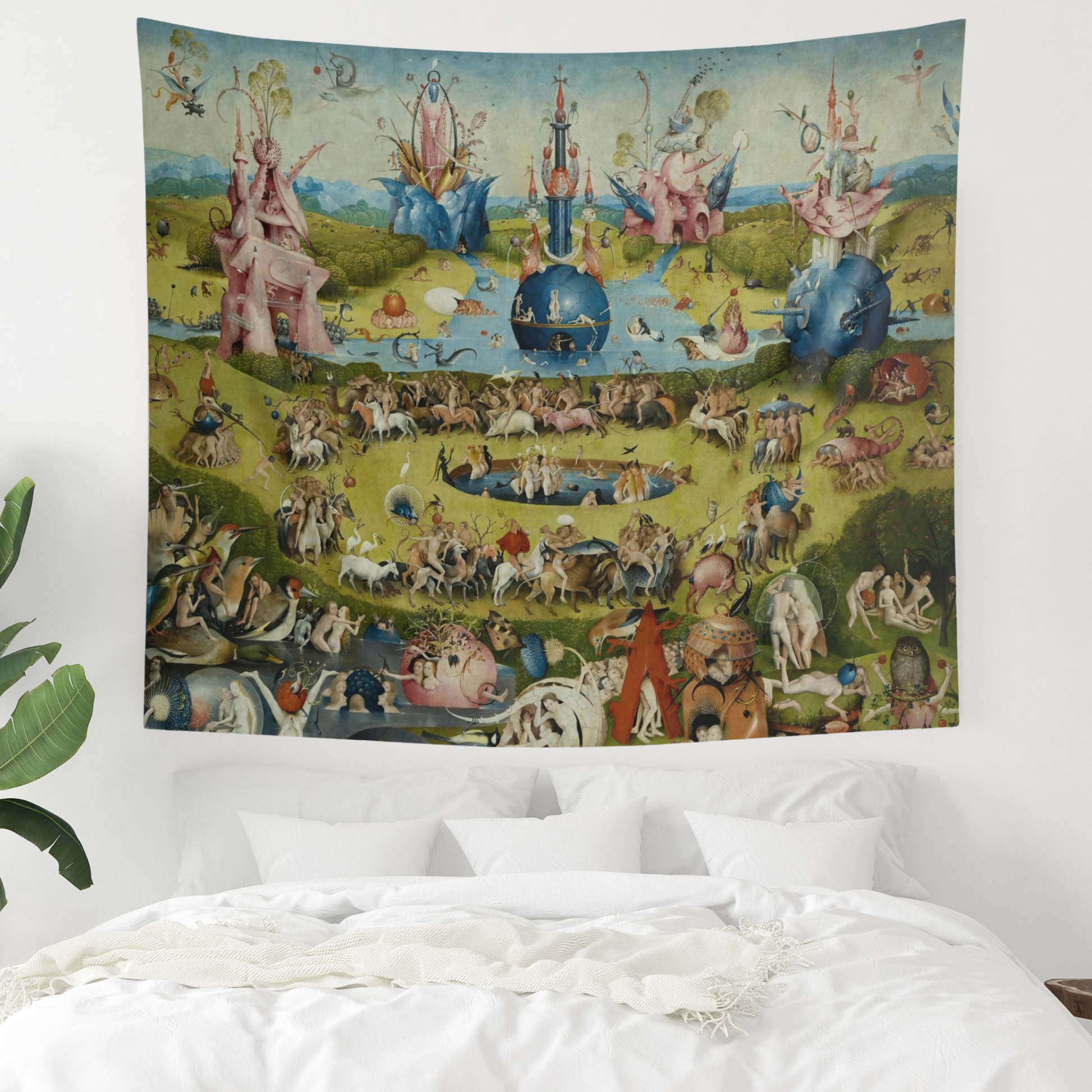 a large tapestry hanging on a wall above a bed