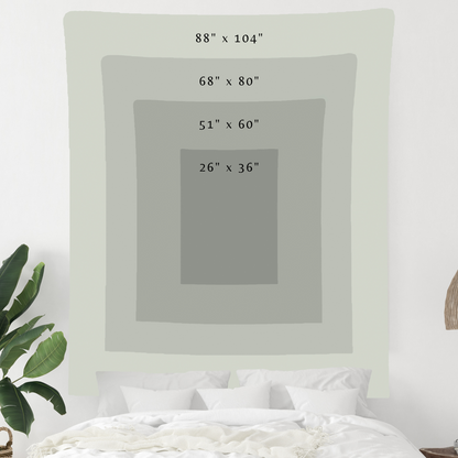 a bed with a white blanket on top of it