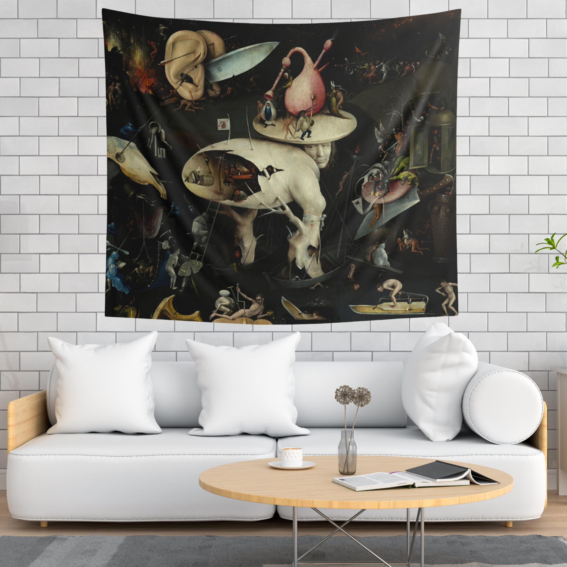 a living room with a white couch and a painting on the wall